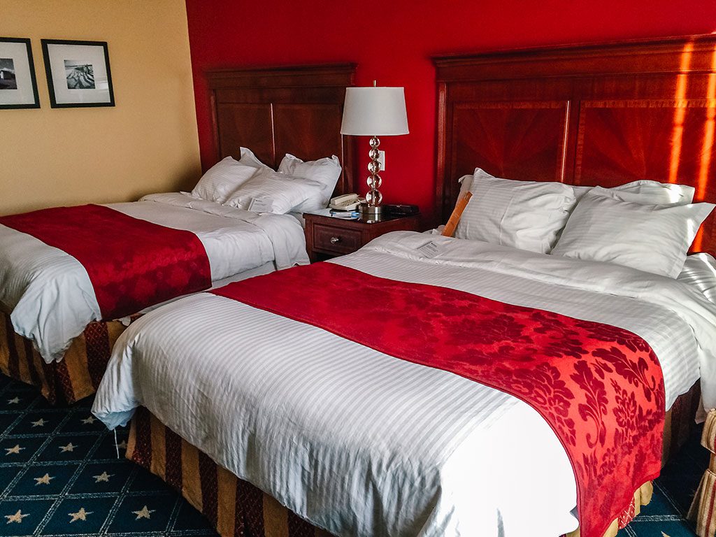 Things to Do in Gettysburg PA: Beds with red bedding at the Wyndham Gettysburg Hotel