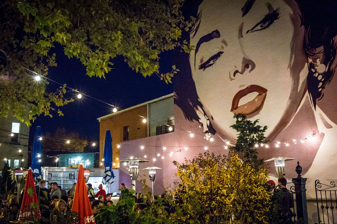 Dacha Beer Garden: Outdoor evening view of Dacha Beer Garden, an ideal spot for a lively happy hour in DC.