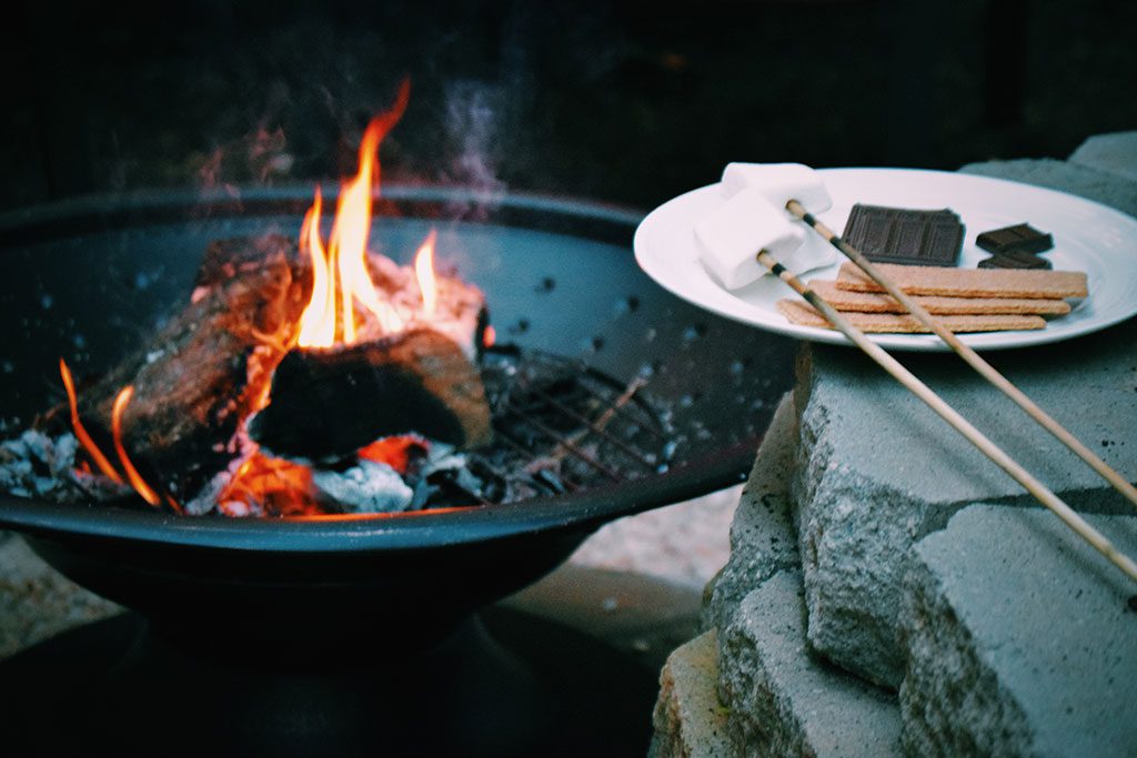 Roast marshmallows around a campfire in Maryland