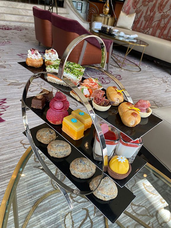 This tiered tray of delicate treats, reminiscent of what you'd find at an afternoon tea Washington DC experience