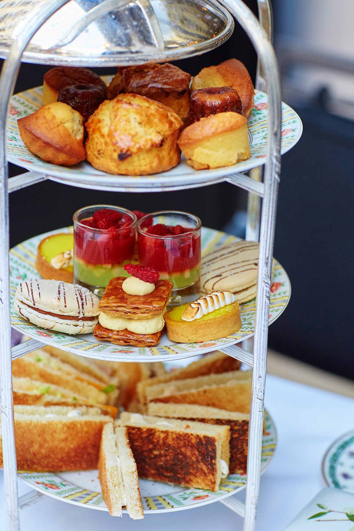 A tiered afternoon tea stand filled with an assortment of pastries, small sandwiches, and desserts, suitable for an FAQ section about afternoon tea Washington DC.